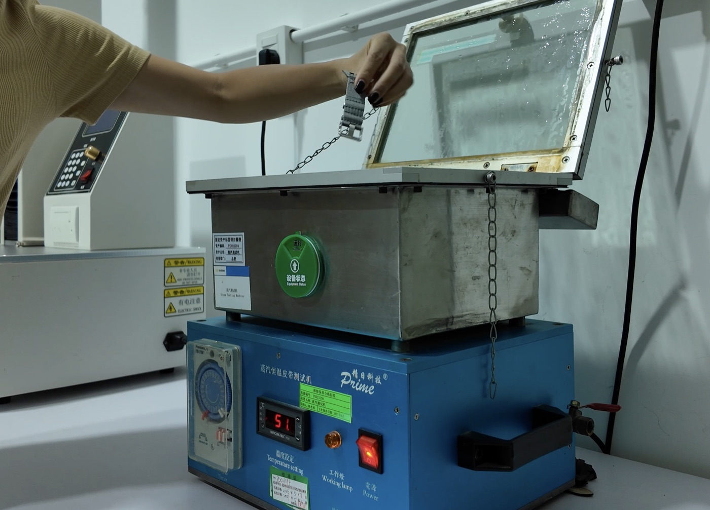 A Lattice strap being lowered into a steam and constant-temperature test chamber.